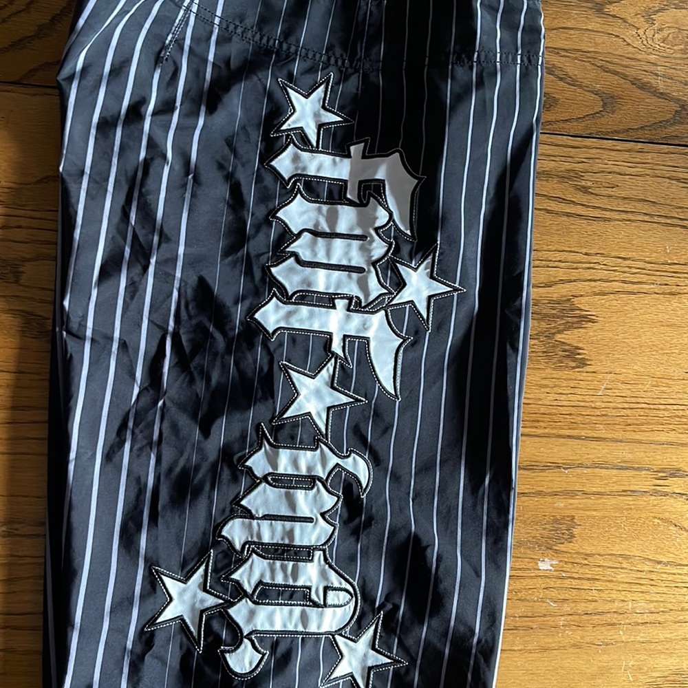 Men’s board shorts. Black with white stripes. Size 36. EUC